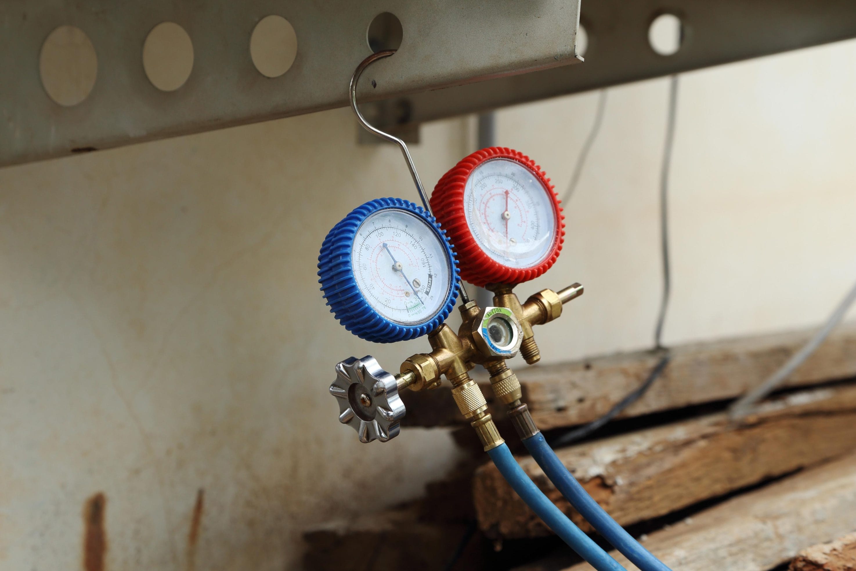 Technician Performing AC Inspection with Digital Manifold Gauge
